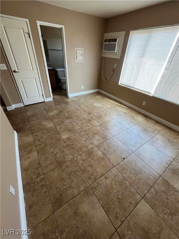 Unfurnished room featuring tile patterned floors,
