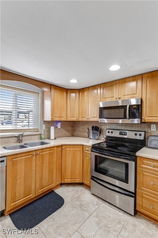 Kitchen with appliances with stainless steel finis