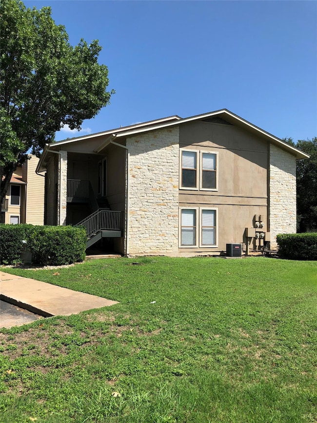 View of home's exterior featuring stone siding, a