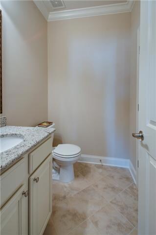 There is a bathroom on each of the 3 floors in this townhome, this is a photo of the downstairs half bath.