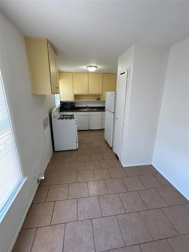 Kitchen featuring light tile patterned flooring, s