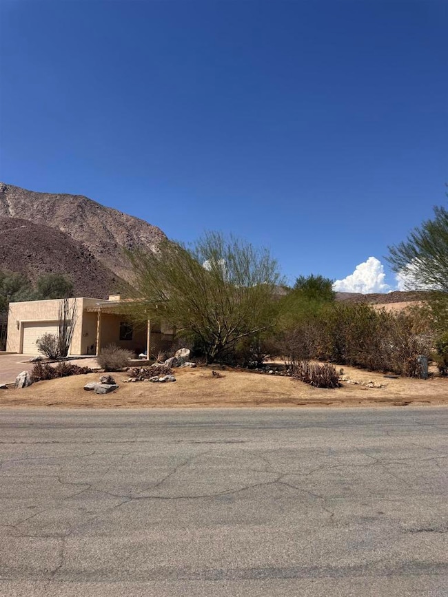 Front exterior with yard on 0.39 acre lot