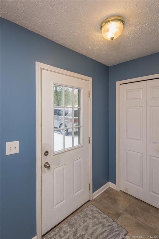 front entry hall with coat closet