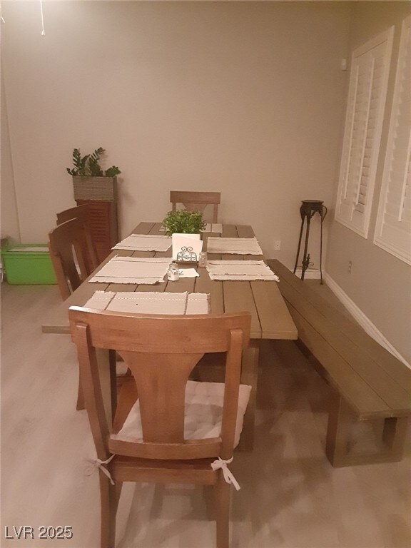 Dining space featuring baseboards and wood finishe