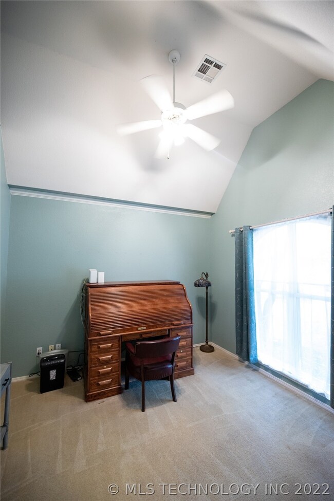 Spacious dedicated office with vaulted ceiling and