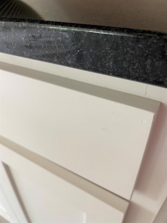 white cabinets and black pearl granite