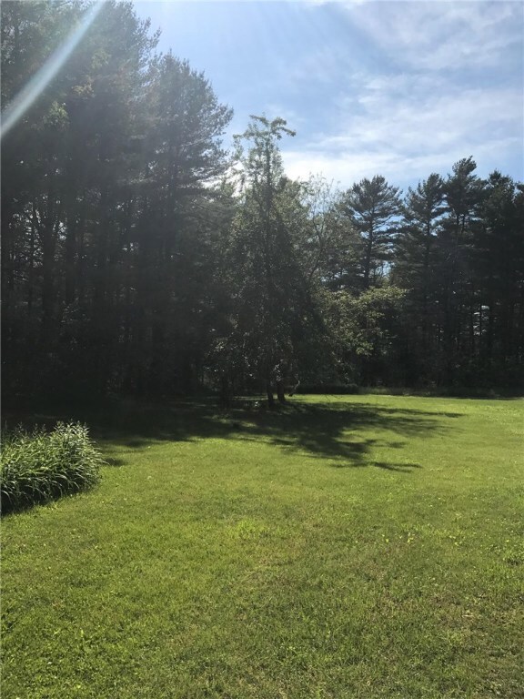 Home sits on 2.7 acres of park-like grounds.
