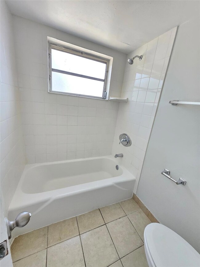 Bathroom has a tub/shower combo
