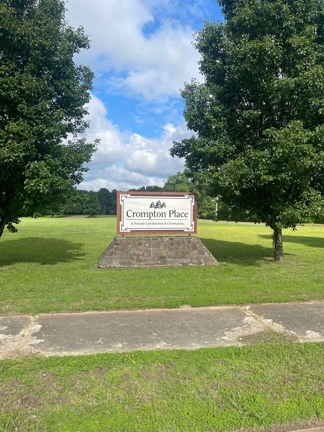 Community / neighborhood sign with a lawn