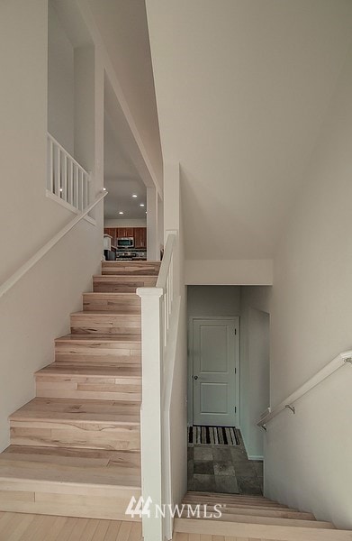 As you enter. Upstairs to main level. Down to full bath and bedroom and garage.