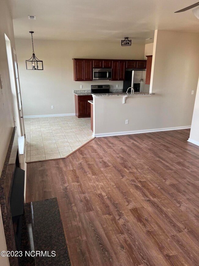 family to kitchen/dining area
