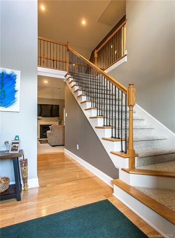 Foyer with wrought iron railings.