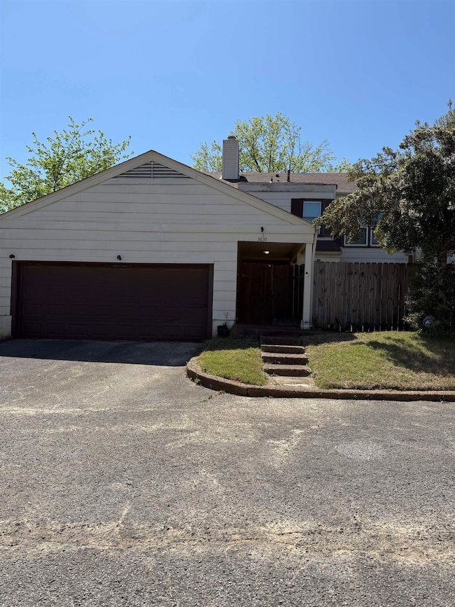 View of front of property featuring an attached ga
