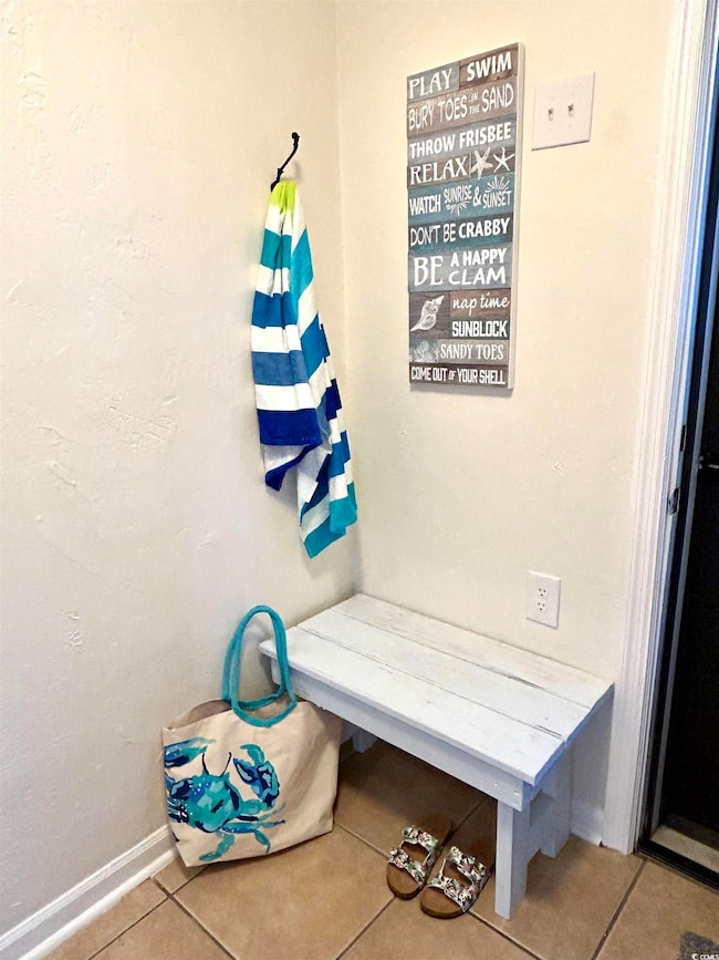Mudroom with tile floors