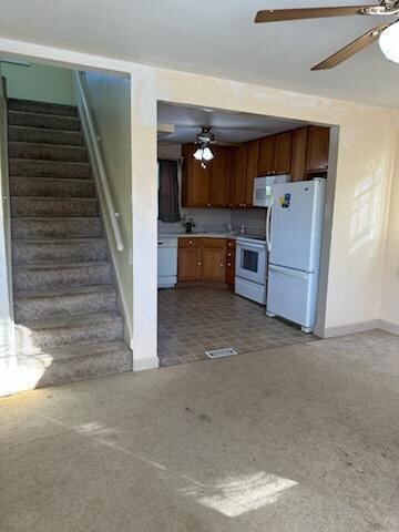 View of stairs/kitchen from front door