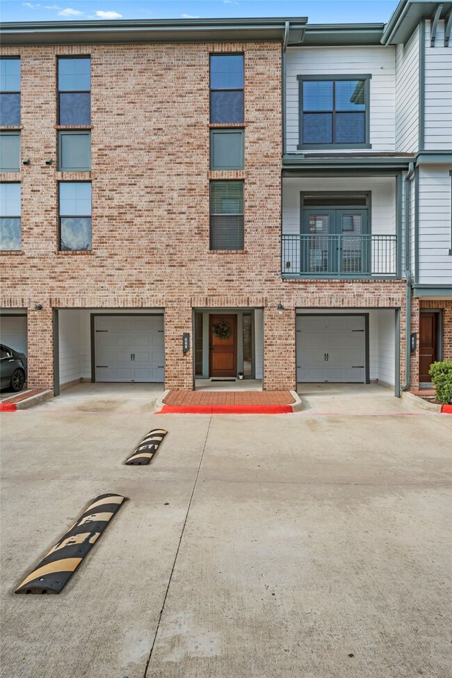Beautiful brick exterior with second floor balcony