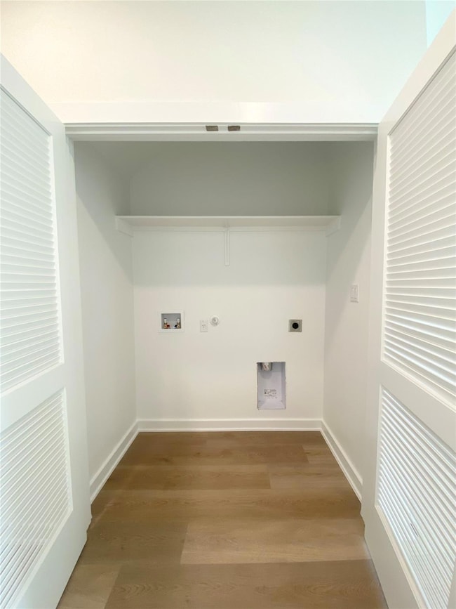 Laundry area featuring electric dryer hookup, gas