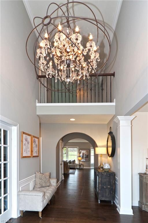 Beautiful Foyer with Arched Entry to the Back of t