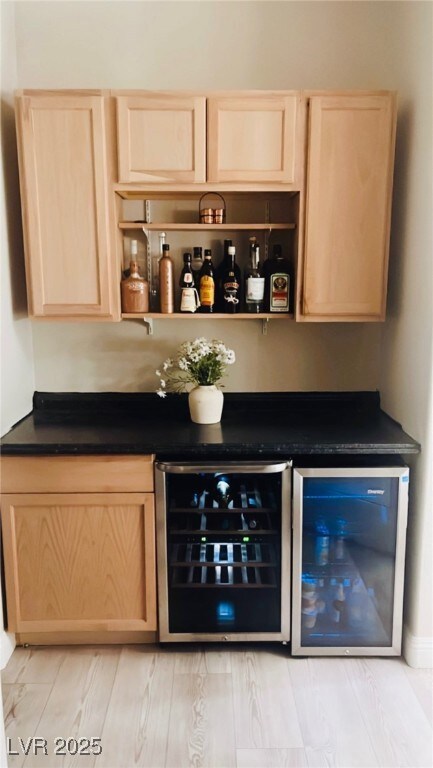 Indoor dry bar featuring beverage cooler