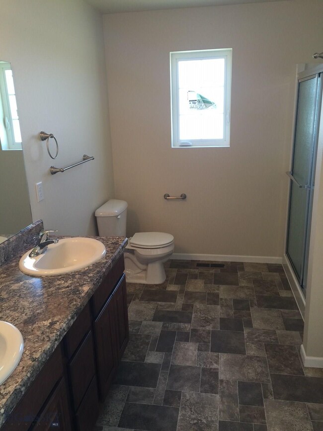 Master bath. Photo of similar home.