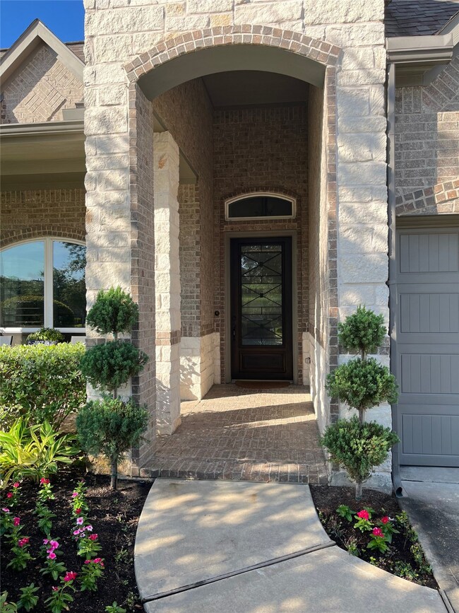Front entry with oversized door.