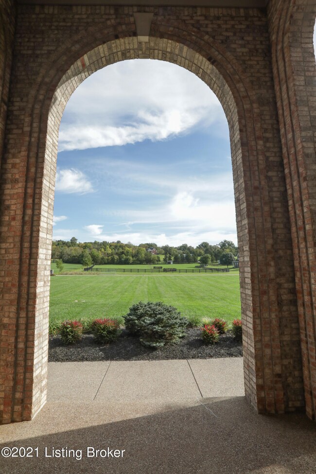 View from front porch through arched ope