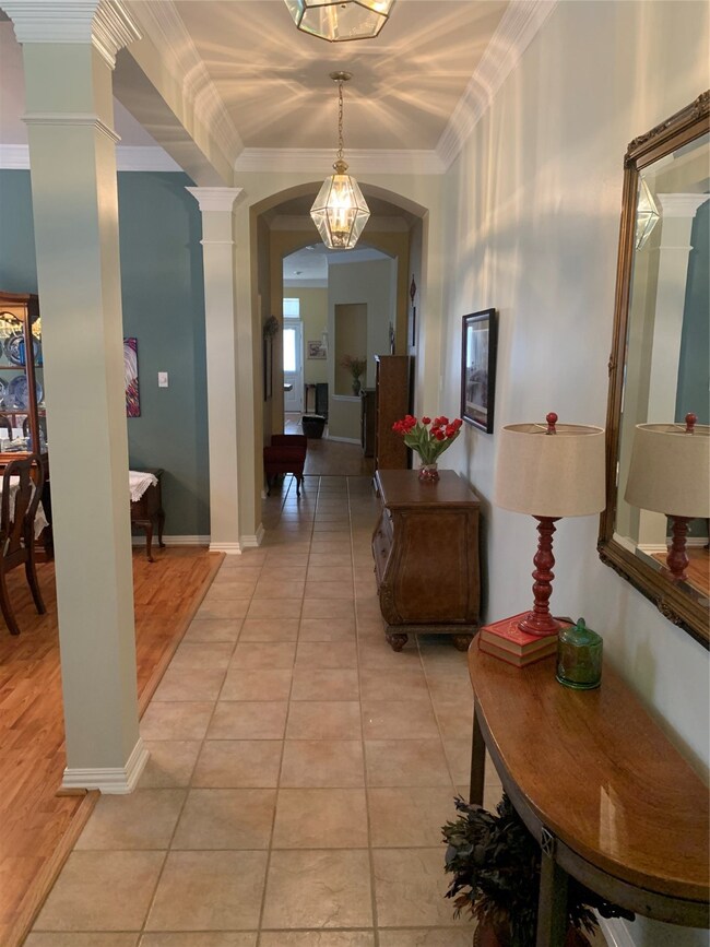 Walk inside to the tiled entryway.