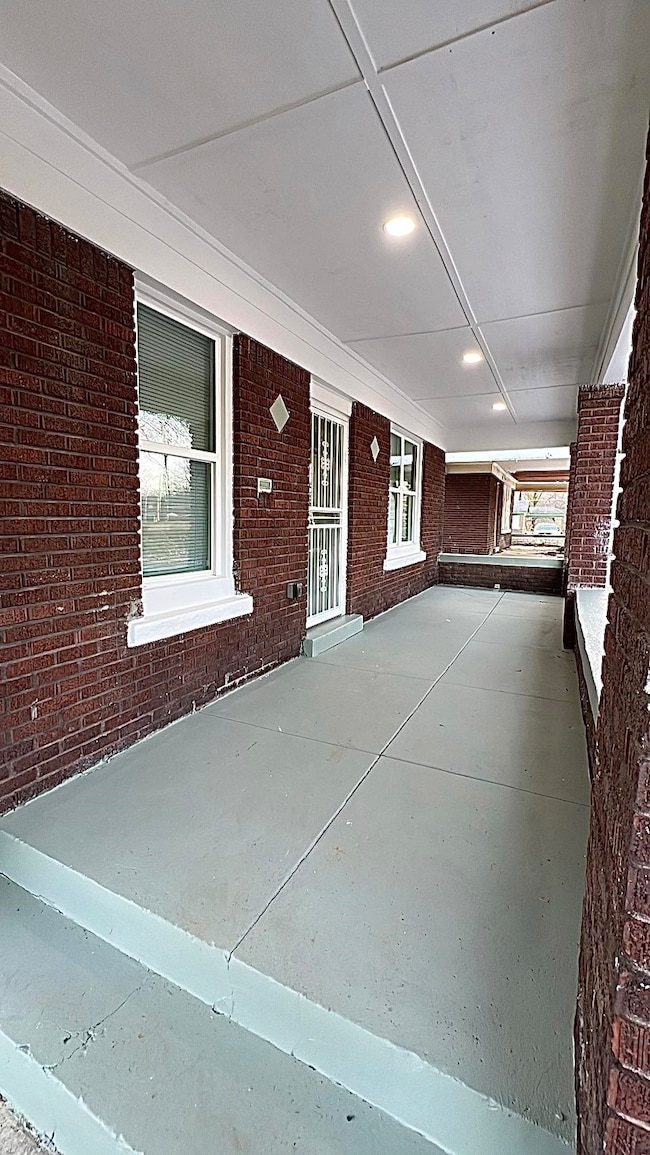 Property entrance with brick siding