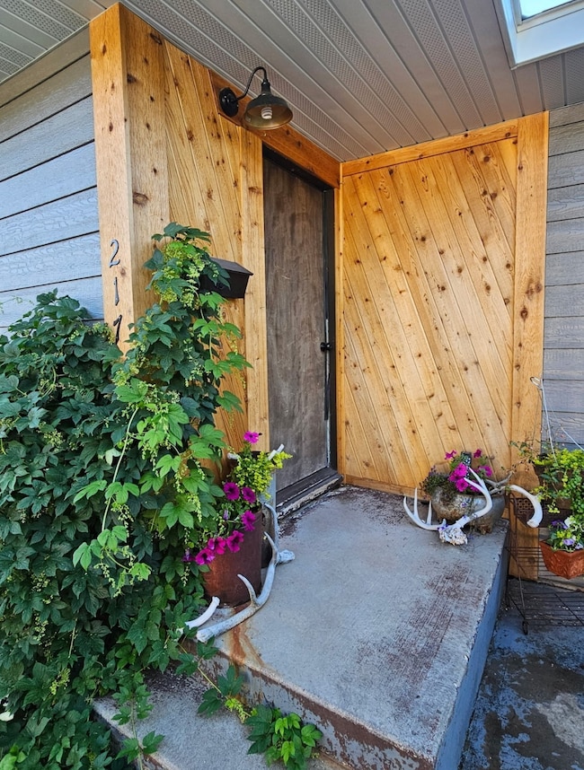 Property entrance with a patio area