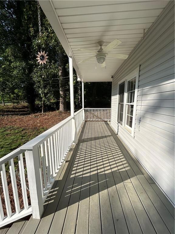 Porch featuring a ceiling fan