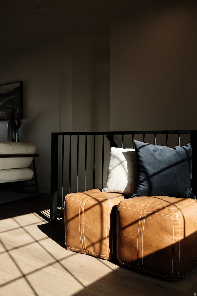 Bedroom featuring wood finished floors and baseboards