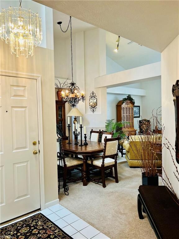 Dining space featuring a notable chandelier, light