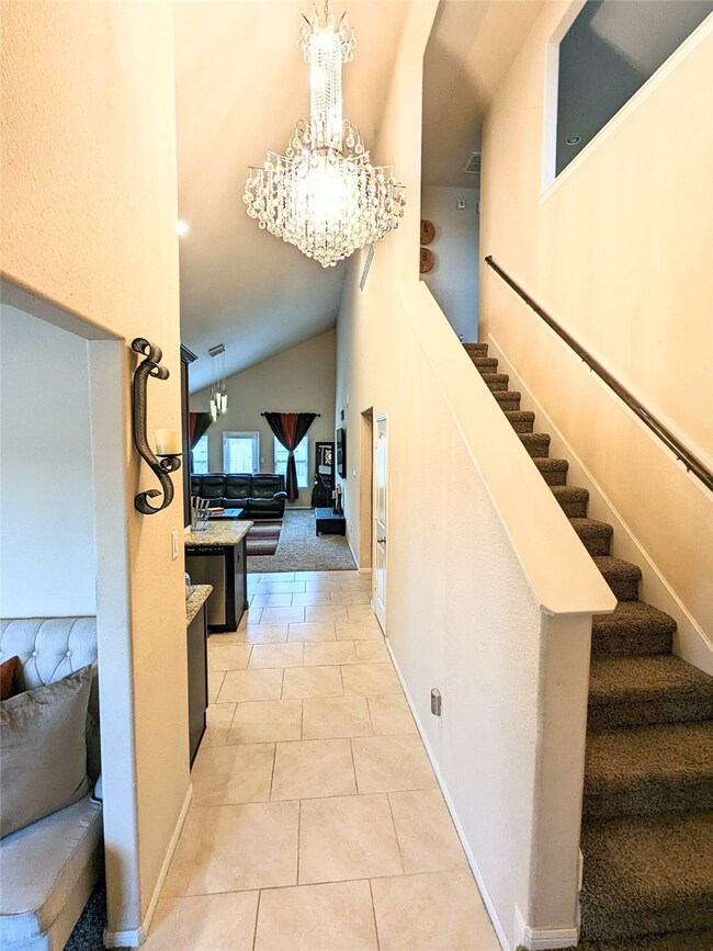 Beautiful foyer with high ceiling and crystal chandelier!