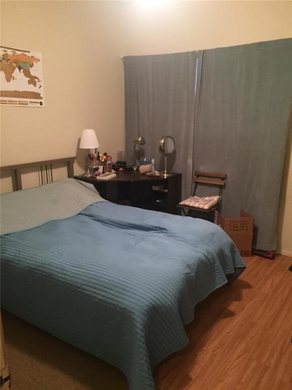 Bedroom with wood finished floors