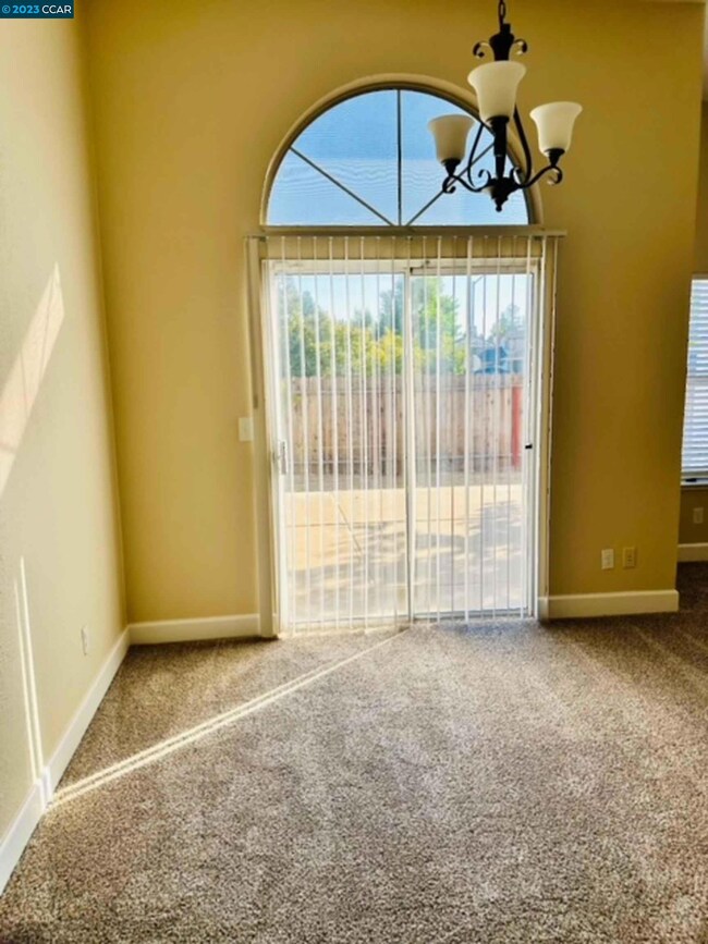vaulted ceilings, arched window, newly painted with new carpet