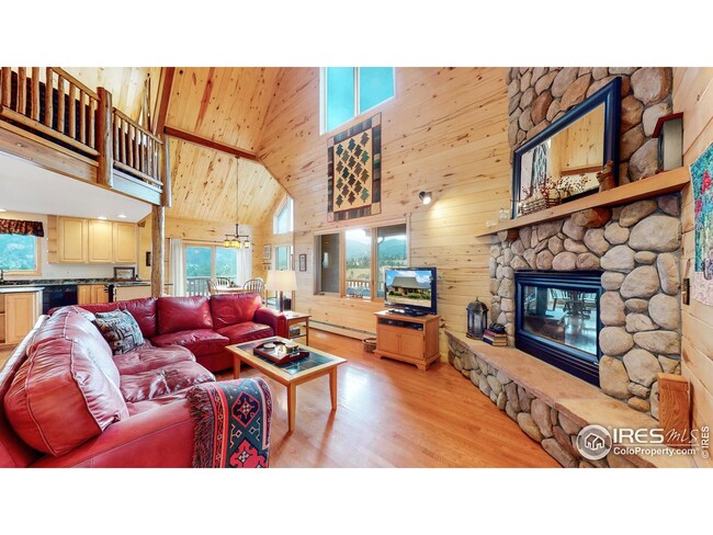 Open floor plan with aspen tongue & groove interior and gas fireplace.