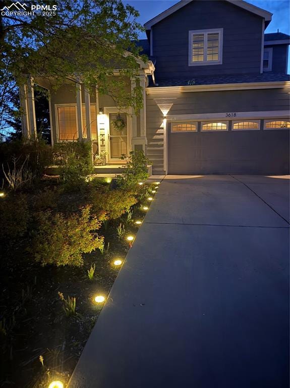 View of front of house featuring a garage and driveway