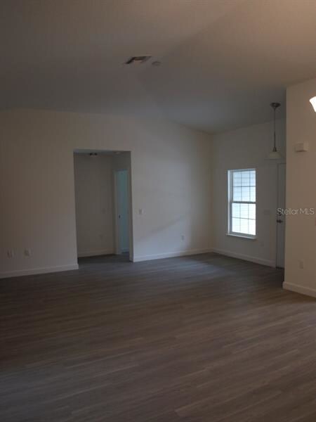 LIVING ROOM FEATURING WOOD STYLE LAMINATE FLOORING