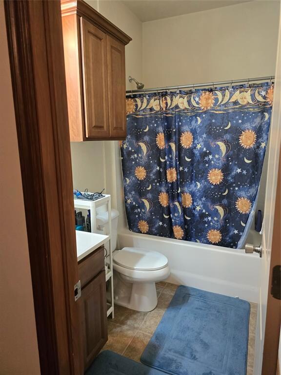 Full bathroom with vanity, tile patterned flooring