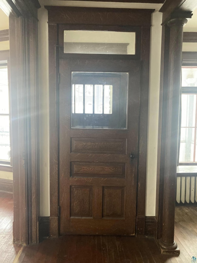 Interior space with radiator heating unit, hardwoo