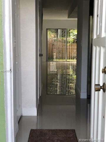 HALL ENTRANCE TO THE HOUSE IN THE BACK FENCED PATI