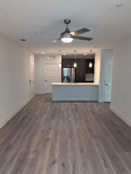 Unfurnished living room with baseboards, ceiling 