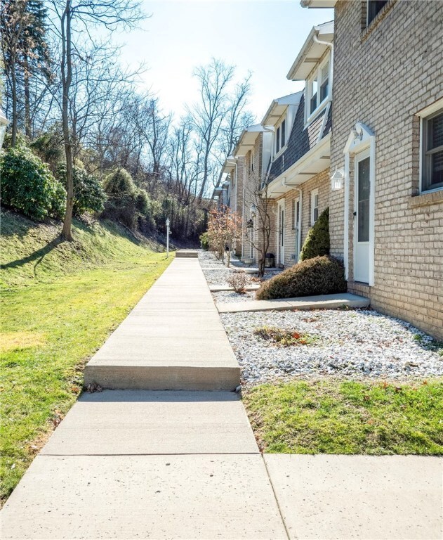 Concrete sidewalks at the front of the home have b