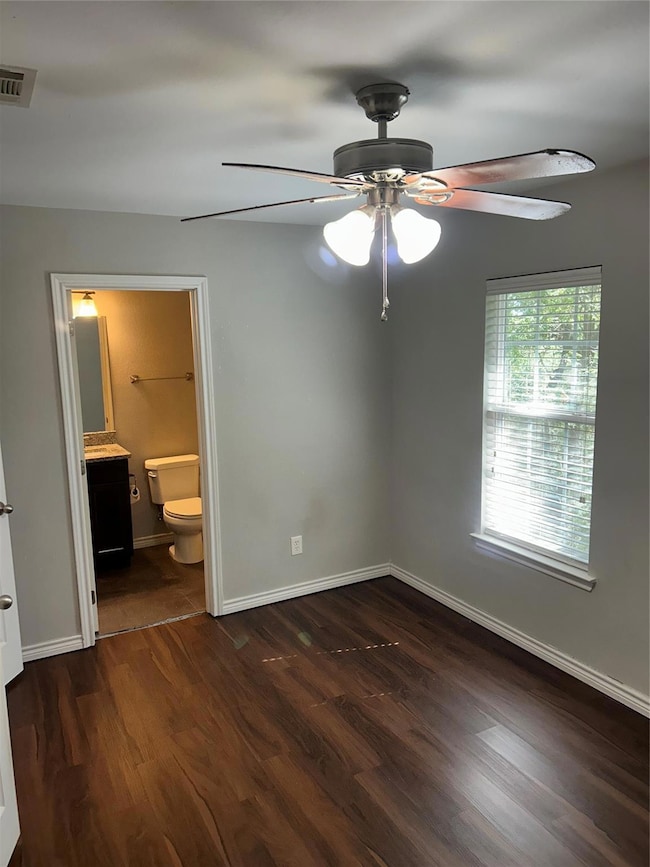 Unfurnished bedroom 2 featuring ceiling fan, ensui