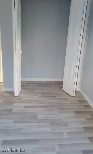 Unfurnished bedroom featuring wood finished floors