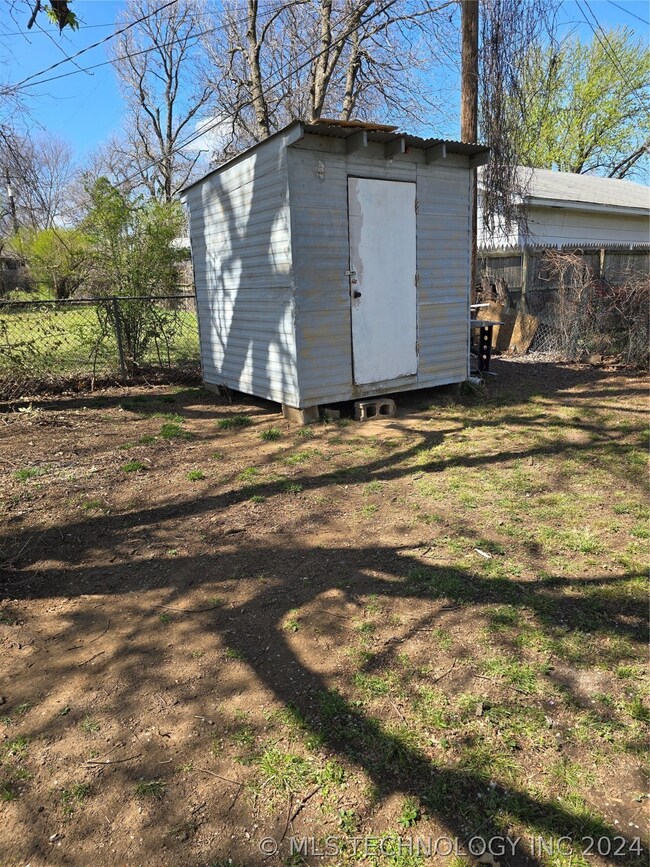 Storage shed in northwest corner of back yard