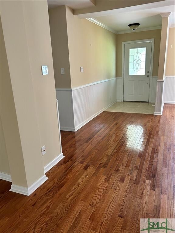 Open concept  with hardwood flooring.