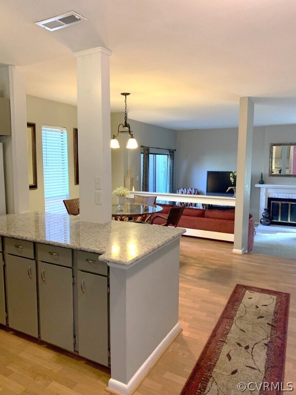 Kitchen opens to Dining and Living Rooms