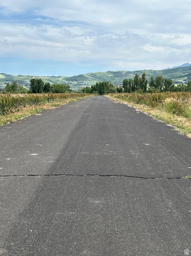 View of asphalt road featuring a mountain view