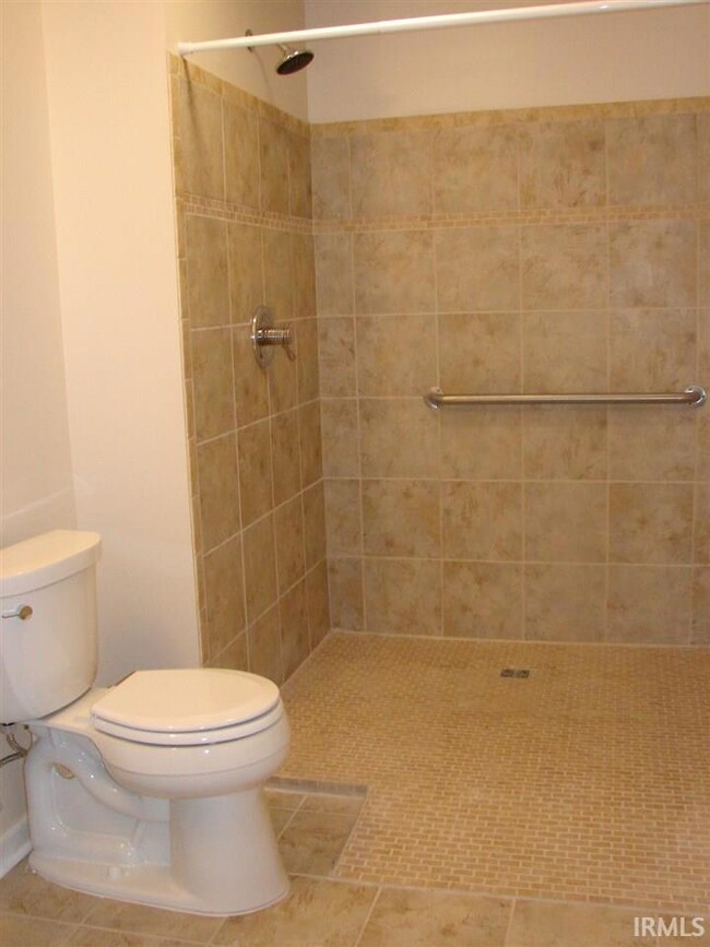 Roll-in, large shower with beautiful tile work.